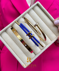 Ekser, Love, tamno plava Lora narukvice u boji zlata.